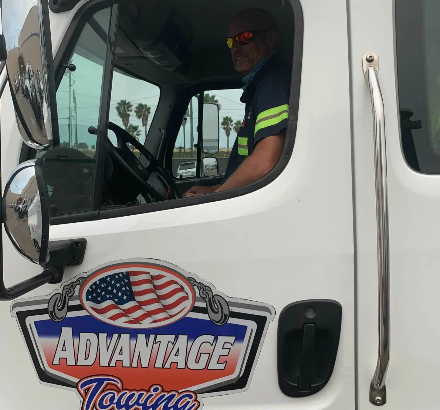 Door logo of an Advantage Towing truck