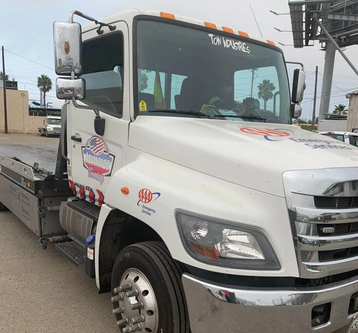 Cab of an Advantage Towing rollback from the front quarter