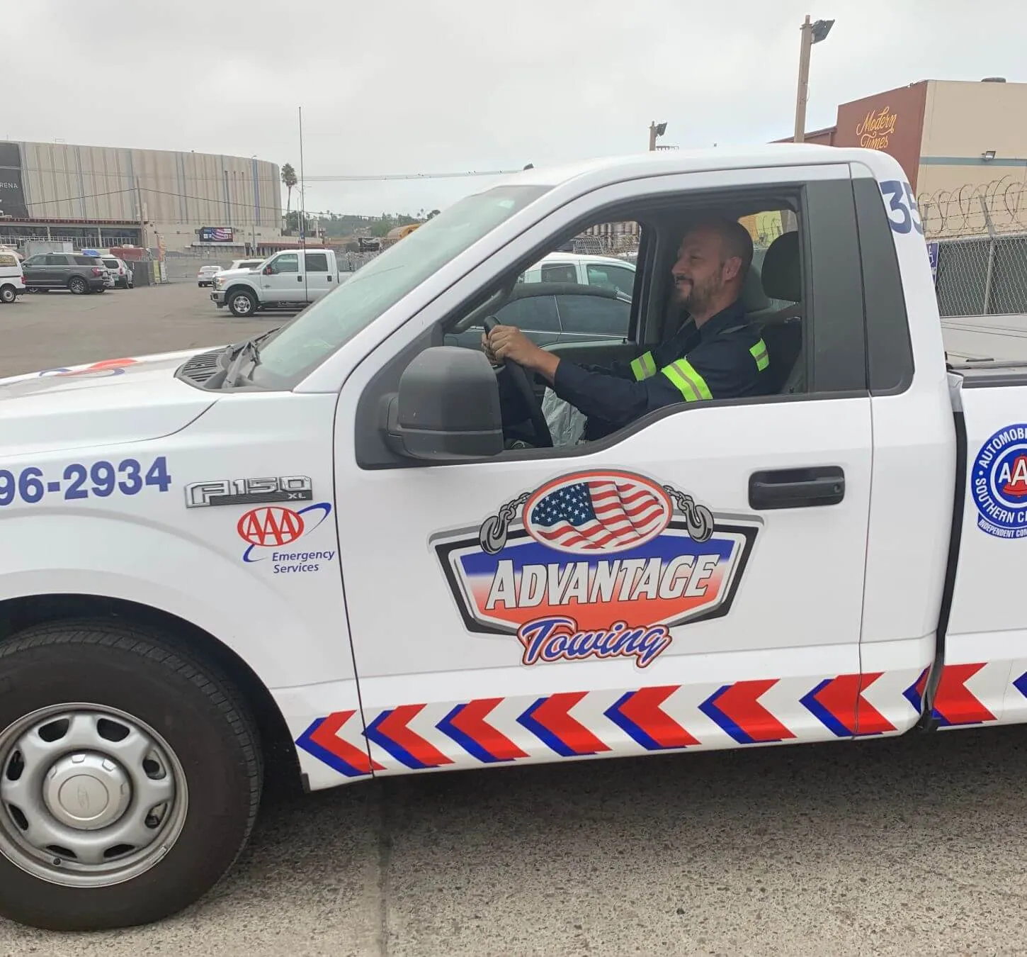 Operator at the wheel of a roadside service pickup
