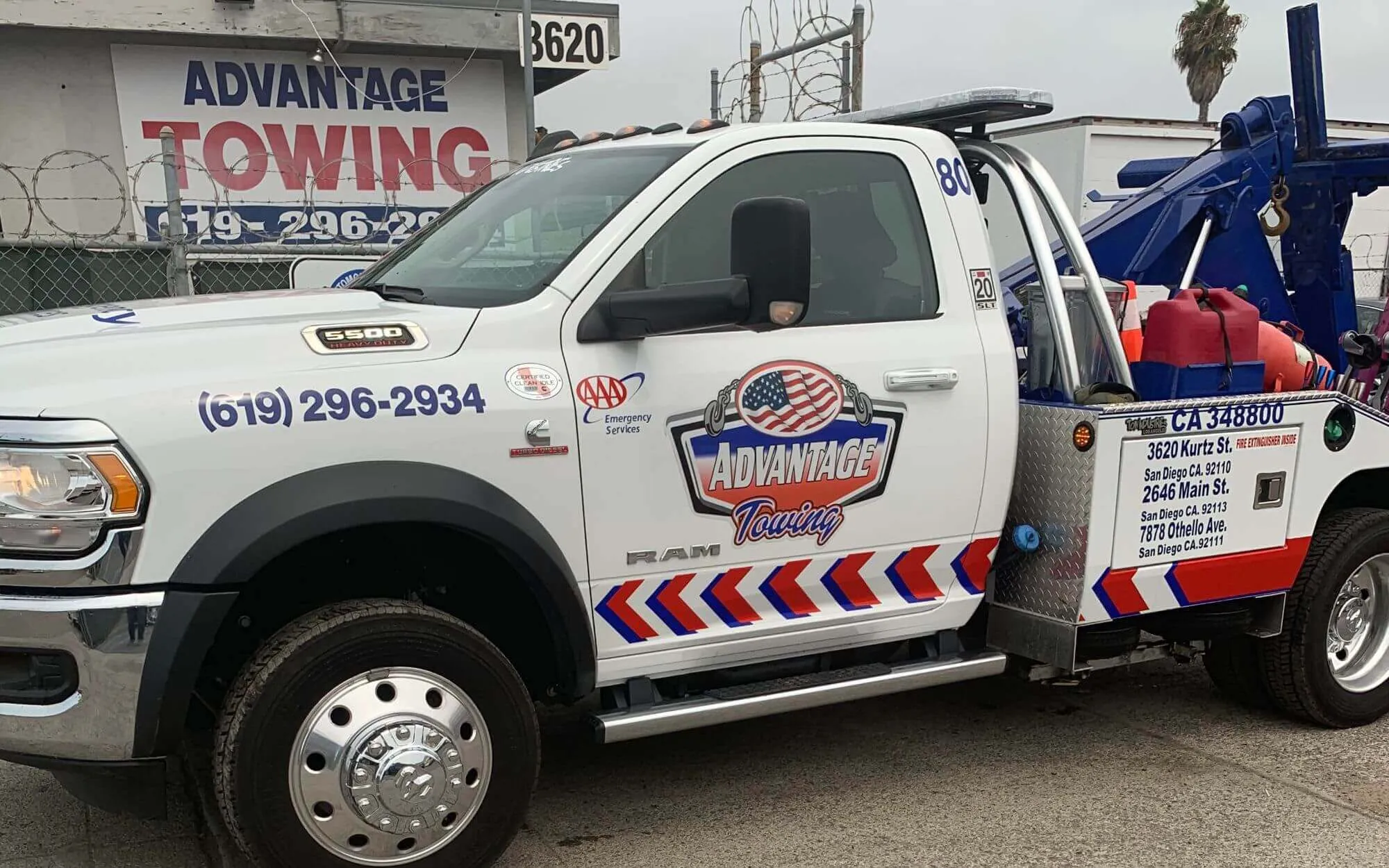 Advantage Towing wrecker in front of the Kurtz Street yard sign in San Diego